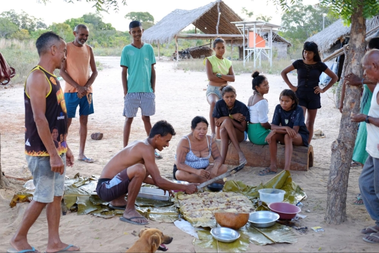 indigenous group gathered preparing food